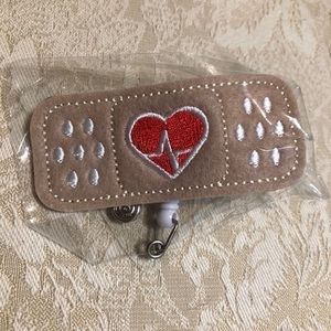 Bandaid‎ retractable badge reel